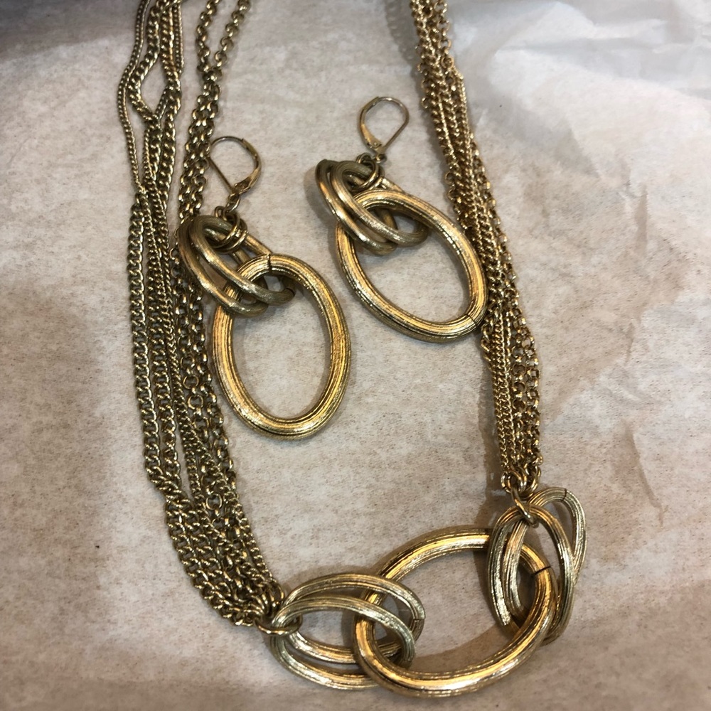 Gold chain necklace with earrings and/or bracelet.
